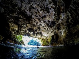 Cave entrance while cave tubing in Belize