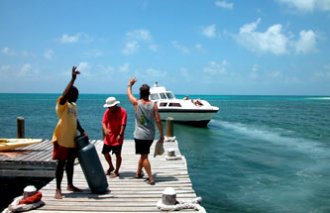 Our boat, Batfish, arrives for another great week on the caye!